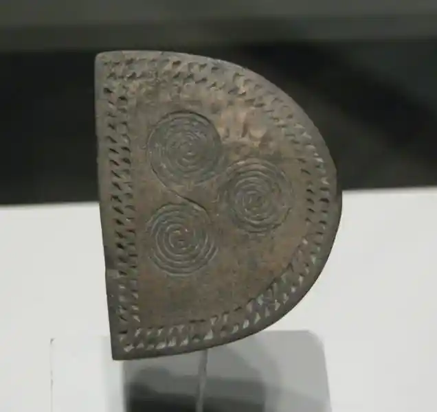 Triskele on a belt buckle